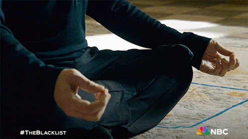 A Man Sits In A Lotus Position With #Theblacklist On The Bottom GIF