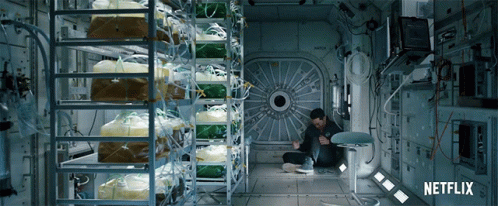 A Man Sits In A Room With Netflix Written On The Bottom Right GIF