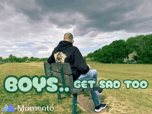A Man Sits On A Park Bench With The Words " Boys Get Sad Too " Below Him GIF