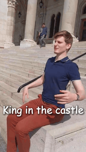 A Man Sits On A Set Of Stairs With The Words King In The Castle Written Below Him GIF