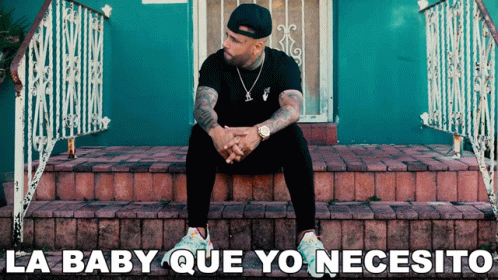 A Man Sits On A Set Of Steps With The Words La Baby Que Yo Necesito GIF