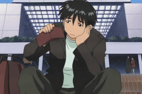 A Man Sits On The Ground Holding His Wallet GIF