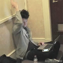 A Man Sitting At A Desk With A Laptop And A Bottle Of Water With The Word Bastillestorm On The Bottom GIF