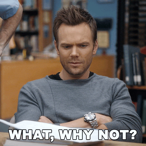 A Man Sitting At A Desk With His Arms Crossed And The Words " What Why Not " Written On The Bottom GIF