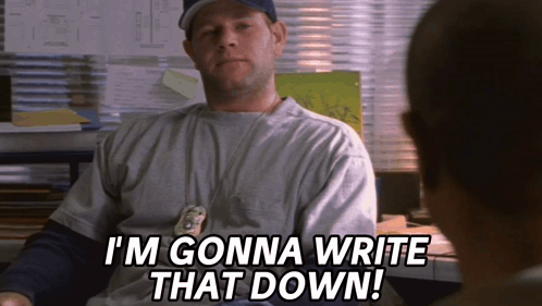 A Man Sitting At A Desk With The Words I 'M Gonna Write That Down On His Shirt GIF