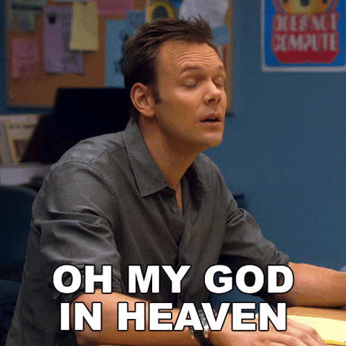 A Man Sitting At A Desk With The Words Oh My God In Heaven Written Below Him GIF