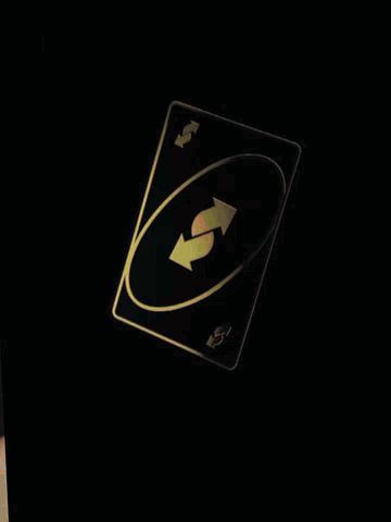 a man sitting at a table with a bingx shirt on