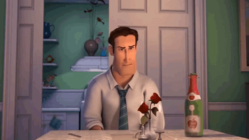A Man Sitting At A Table With A Bottle Of Apple Juice GIF