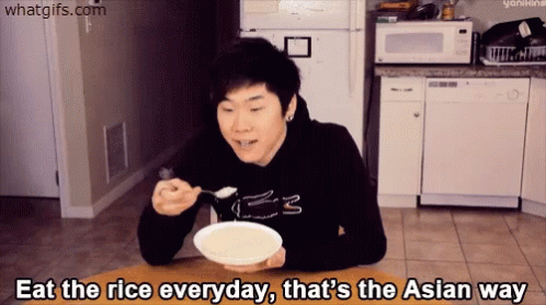 A Man Sitting At A Table With A Bowl Of Rice And The Words Eat The Rice Everyday GIF
