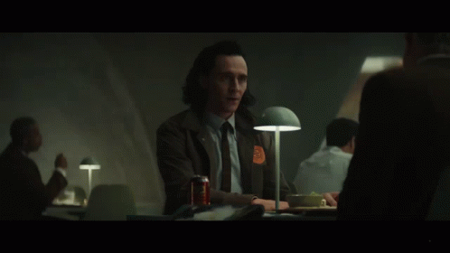 A Man Sitting At A Table With A Can Of Soda And The Word Anyway On The Bottom GIF