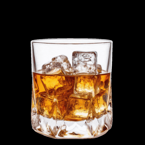 A Man Sitting At A Table With A Glass Of Whiskey And A Prayer GIF
