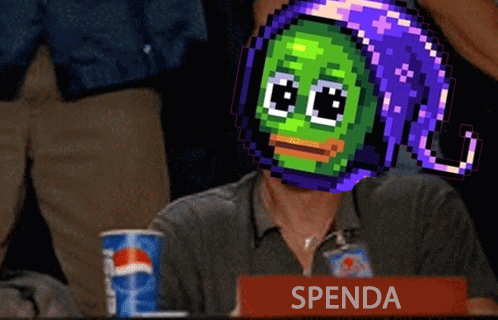 A Man Sitting At A Table With A Sign That Says Spenda In Front Of Him GIF