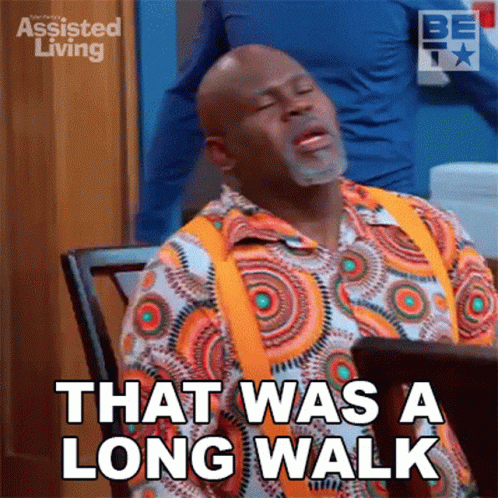 A Man Sitting At A Table With His Eyes Closed And Says That Was A Long Walk GIF