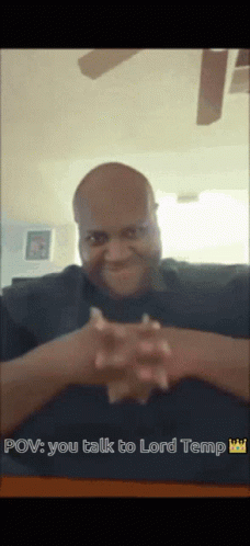 A Man Sitting At A Table With His Hands Folded And The Words Pov You Talk To Lord Temp Above Him GIF