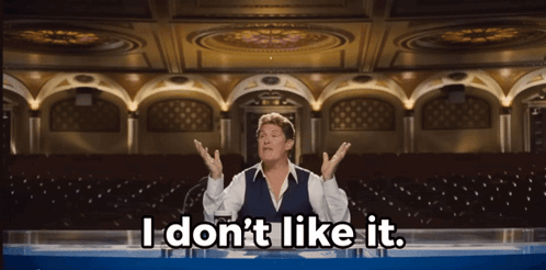 A Man Sitting At A Table With The Words " I Don 'T Like It " Above Him GIF