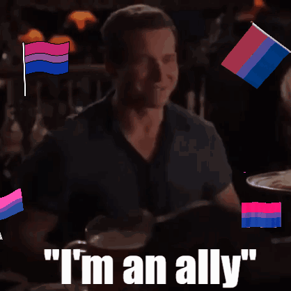 A Man Sitting At A Table With The Words " I 'M An Ally " GIF