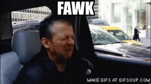 A Man Sitting In A Car With The Word Fawk On The Screen GIF