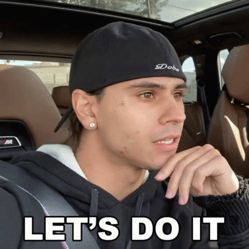 A Man Sitting In A Car With The Words Let 'S Do It Below Him GIF