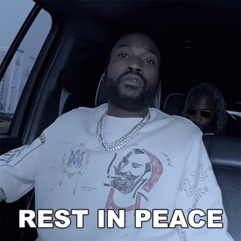 A Man Sitting In A Car With The Words Rest In Peace Written Below Him GIF