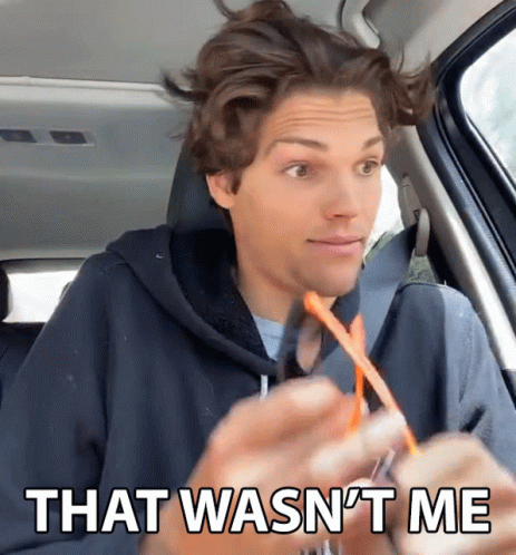 A Man Sitting In A Car With The Words That Wasn 'T Me On The Bottom GIF