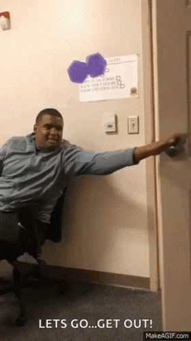 a man sitting in a chair with his arm outstretched and a sign on the wall that says " let 's go "