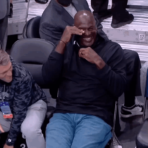 A Man Sitting In A Chair With The Number 17 On The Back Of His Shirt GIF