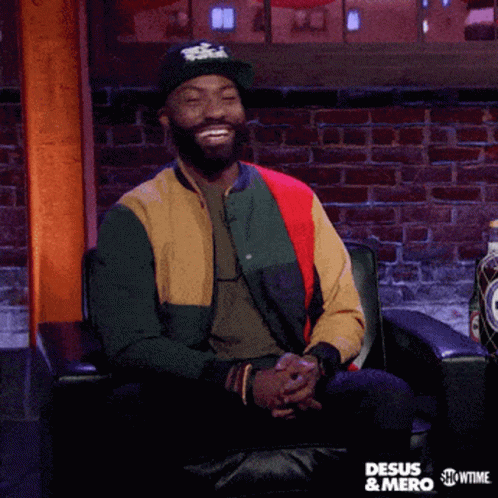 A Man Sitting In A Chair With The Words I 'M Not Judging But I Am Judging On The Bottom GIF