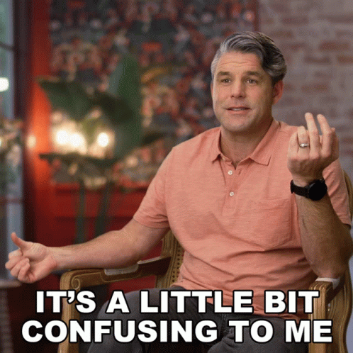 A Man Sitting In A Chair With The Words " It 'S A Little Bit Confusing To Me " GIF