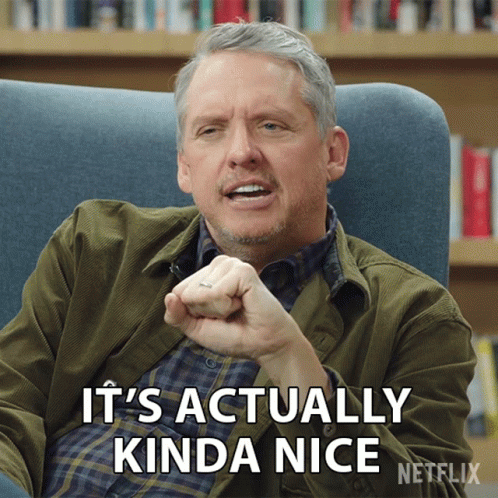 A Man Sitting In A Chair With The Words It 'S Actually Kinda Nice GIF