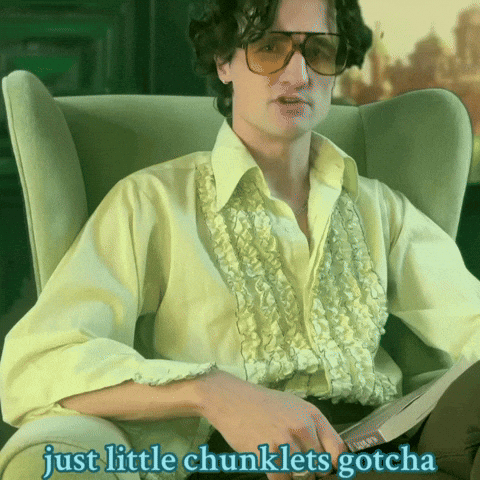 A Man Sitting In A Chair With The Words Just Little Chunklets Gotcha Written Below Him GIF