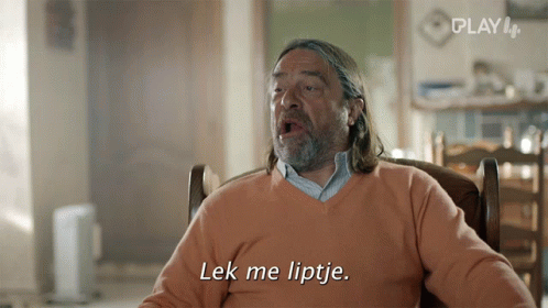 A Man Sitting In A Chair With The Words Lek Me Liptje On The Screen GIF