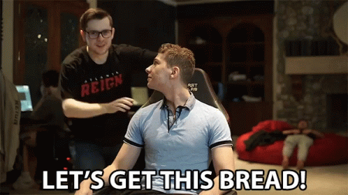 A Man Sitting In A Chair With The Words Let 'S Get This Bread Behind Him GIF