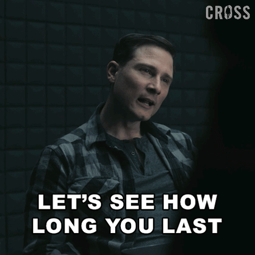 A Man Sitting In A Chair With The Words Let 'S See How Long You Last Above Him GIF