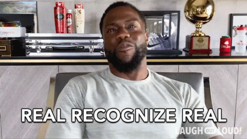 A Man Sitting In A Chair With The Words Real Recognize Real GIF