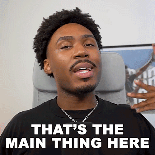 A Man Sitting In A Chair With The Words That 'S The Main Thing Here On His Face GIF