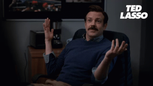 A Man Sitting In A Chair With The Words " The Diamond Dogs Have Struck Again " On The Bottom GIF