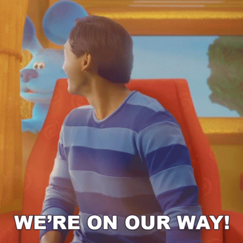 A Man Sitting In A Chair With The Words We 'Re On Our Way GIF