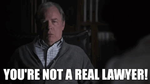 A Man Sitting In A Chair With The Words You 'Re Not A Real Lawyer GIF