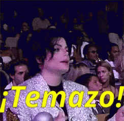 A Man Sitting In A Crowd With The Word Temazo On It GIF