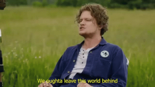 A Man Sitting In A Field With The Words We Oughta Leave This World Behind Below Him GIF
