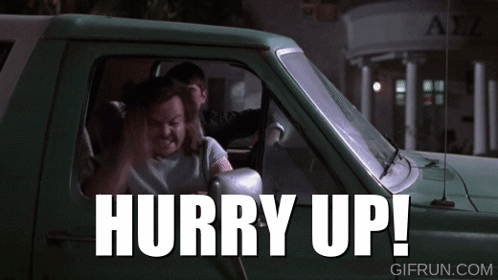A Man Sitting In A Truck With The Words Hurry Up Written On It GIF