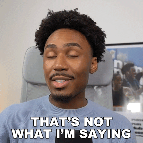 A Man Sitting In An Office Chair With His Eyes Closed And Says " That 'S Not What I 'M Saying " GIF