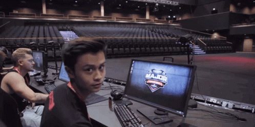 A Man Sitting In Front Of A Computer Screen That Says Major GIF