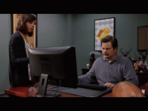 A Man Sitting In Front Of A Dell Computer Monitor GIF