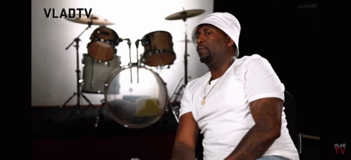 A Man Sitting In Front Of A Drum Set With Vladtv Written In The Corner GIF
