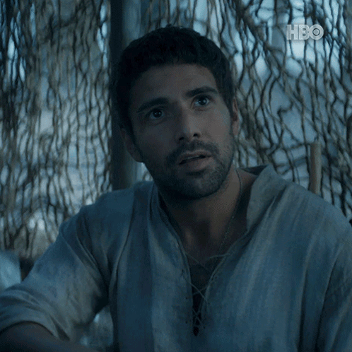 A Man Sitting In Front Of A Fence With The Words Doom And Ruin Surround Us Above Him GIF
