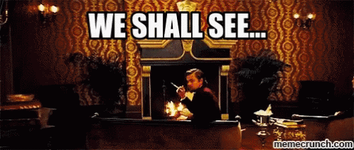 A Man Sitting In Front Of A Fireplace With The Words " We Shall See " Written Above Him GIF