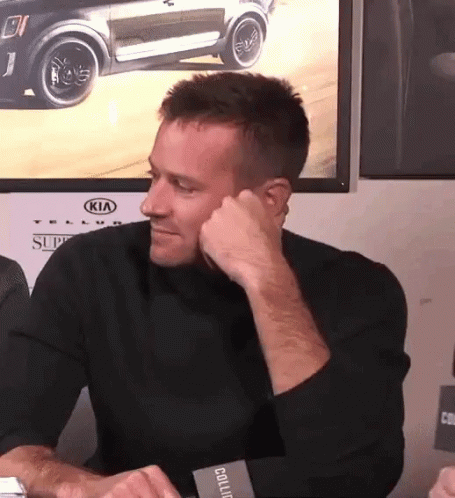 A Man Sitting In Front Of A Kia Car GIF