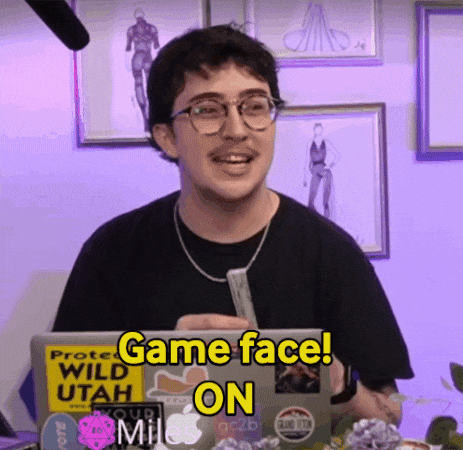 A Man Sitting In Front Of A Laptop With A Sticker That Says Game Face On GIF