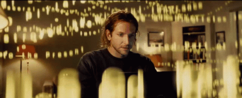 A Man Sitting In Front Of A Laptop With The Word Present Visible GIF